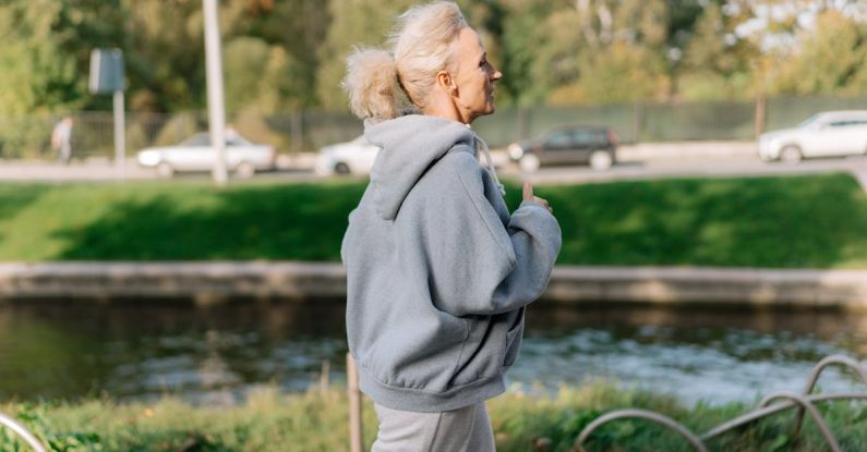 Optimism - Woman in Gray Hoodie Sweater Jogging