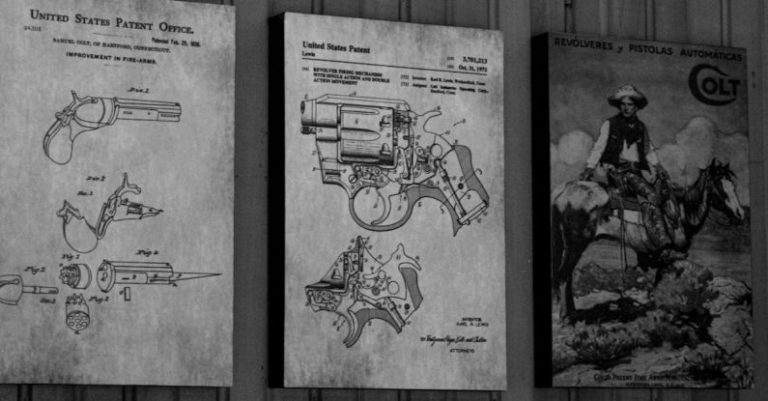 Mechanisms - Vintage Gun on Wall over Drawings of Revolvers Mechanisms