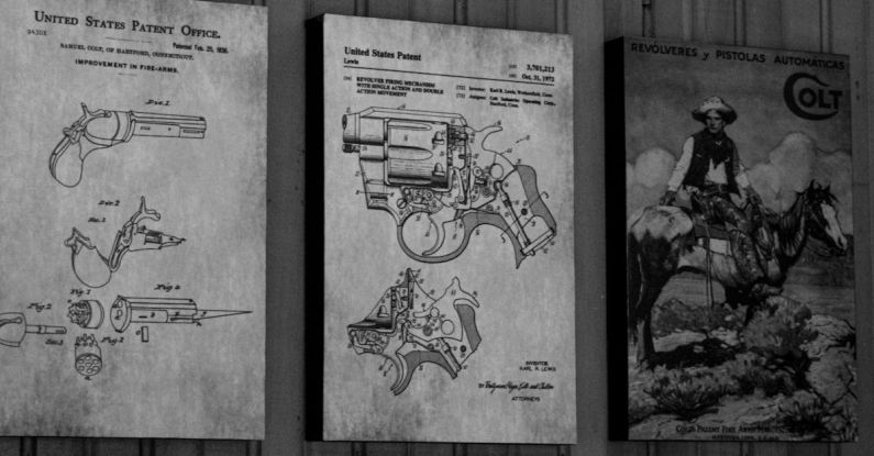 Mechanisms - Vintage Gun on Wall over Drawings of Revolvers Mechanisms