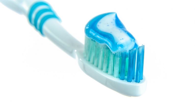 Routine - Blue and White Toothpaste on Toothbrush