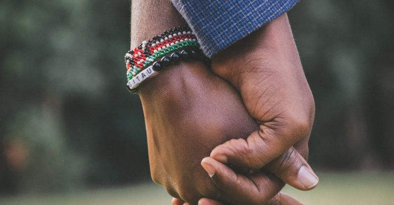 Relationships - close-Up Photo of Two Person's Holding Hands