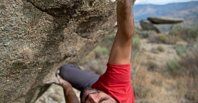 Strength - Man Climbing on Gray Concrete Peak at Daytime