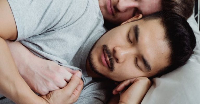 Sleep - Two Men in Bed Holding Hands